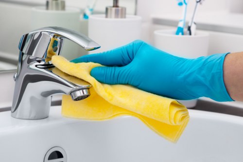 Professional cleaner handling a rental property reset in Queenspark